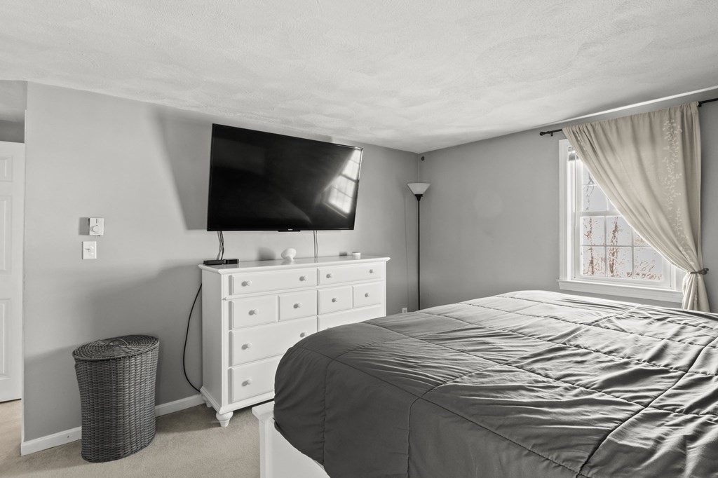 93 Palmer Road Plymouth, MA 02360 - Photo 15 of 34 a bedroom with a bed and a flat screen tv