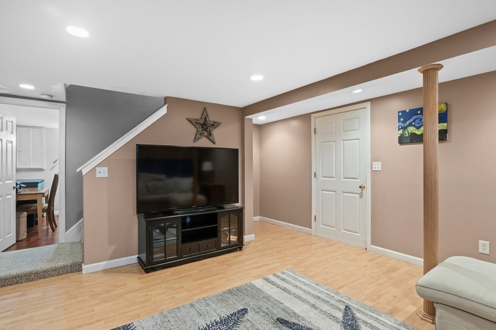 93 Palmer Road Plymouth, MA 02360 - Photo 19 of 34 a living room with furniture and a flat screen tv