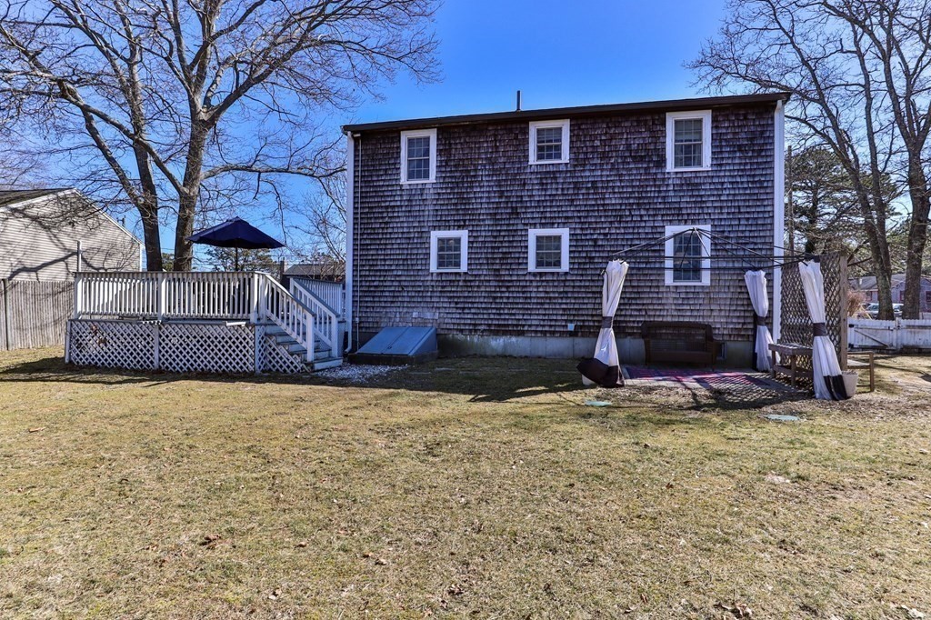 93 Palmer Road Plymouth, MA 02360 - Photo 23 of 34 a brick building with a large tree
