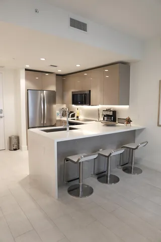 a kitchen with a sink cabinets and counter space