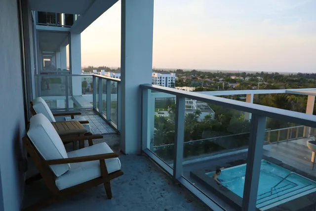 a view of a balcony with chair