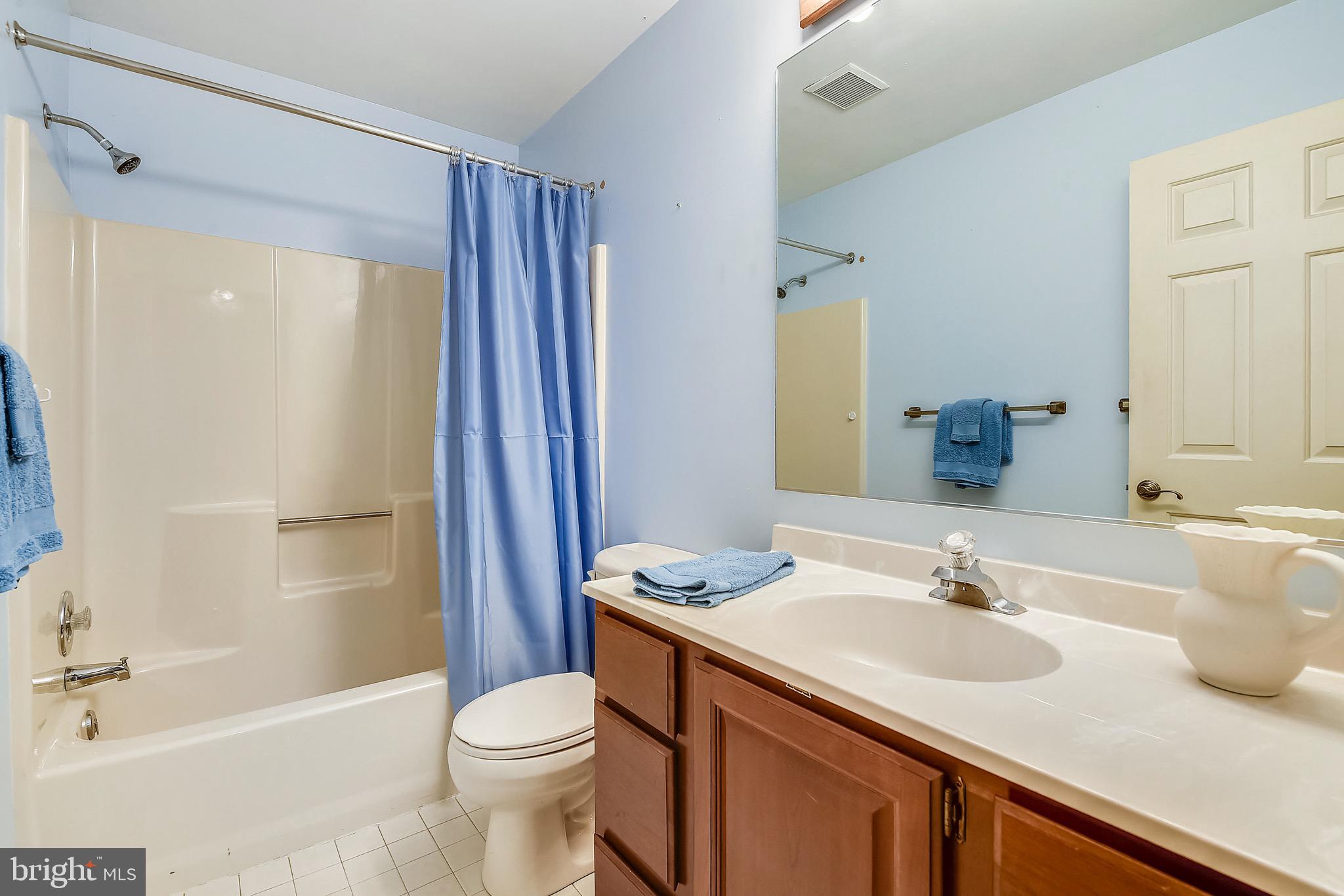 2515 Potts Point Road Huntingtown, MD 20639 - Photo 16 of 19 a bathroom with a sink a toilet and shower