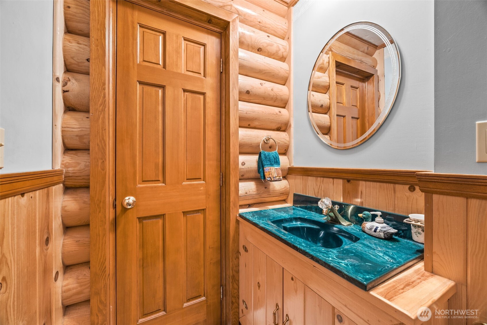 1236 East Island View Road Grapeview, WA 98546 - Photo 15 of 40 a bathroom with a sink and a mirror