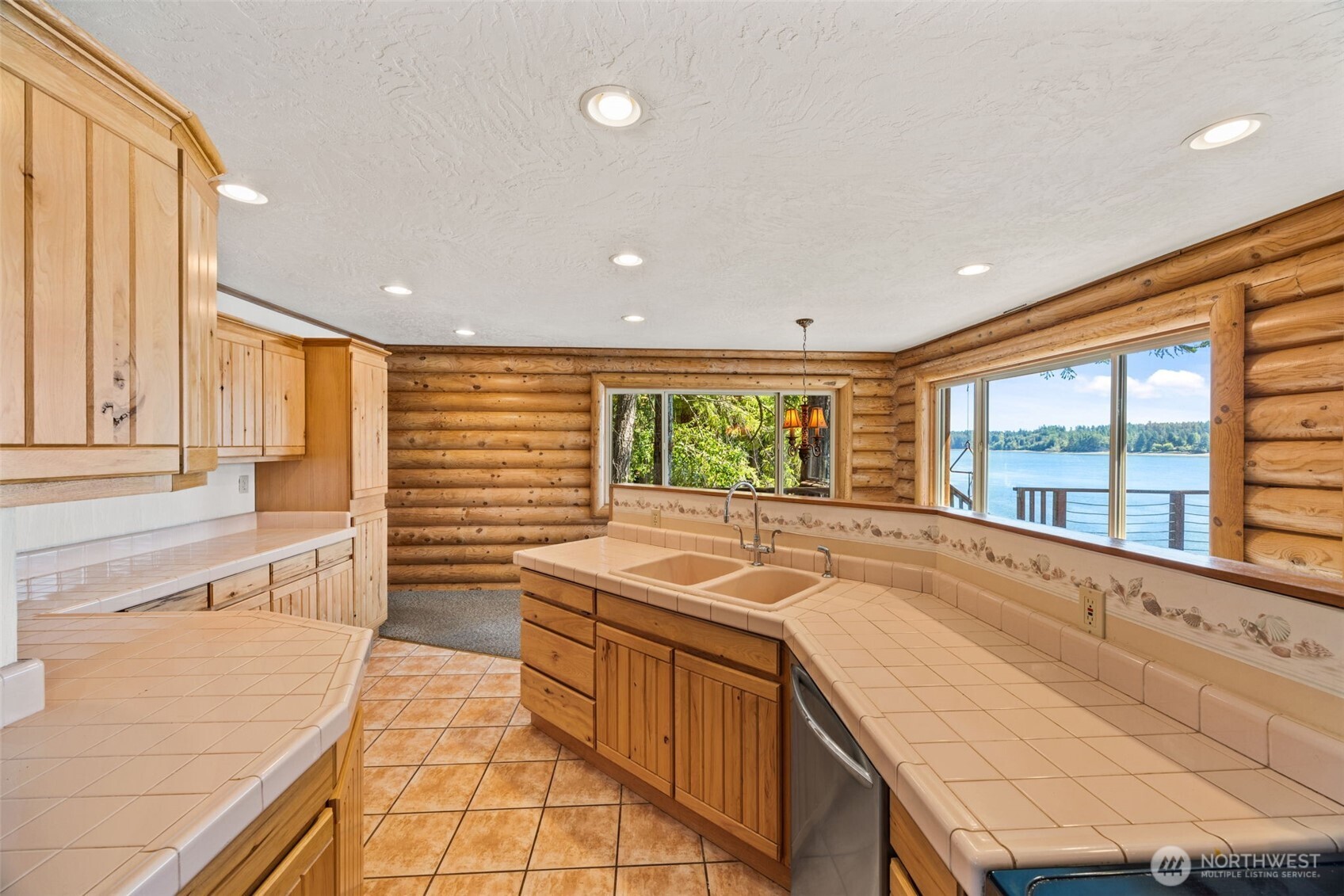 1236 East Island View Road Grapeview, WA 98546 - Photo 16 of 40 a view of a kitchen with a large window