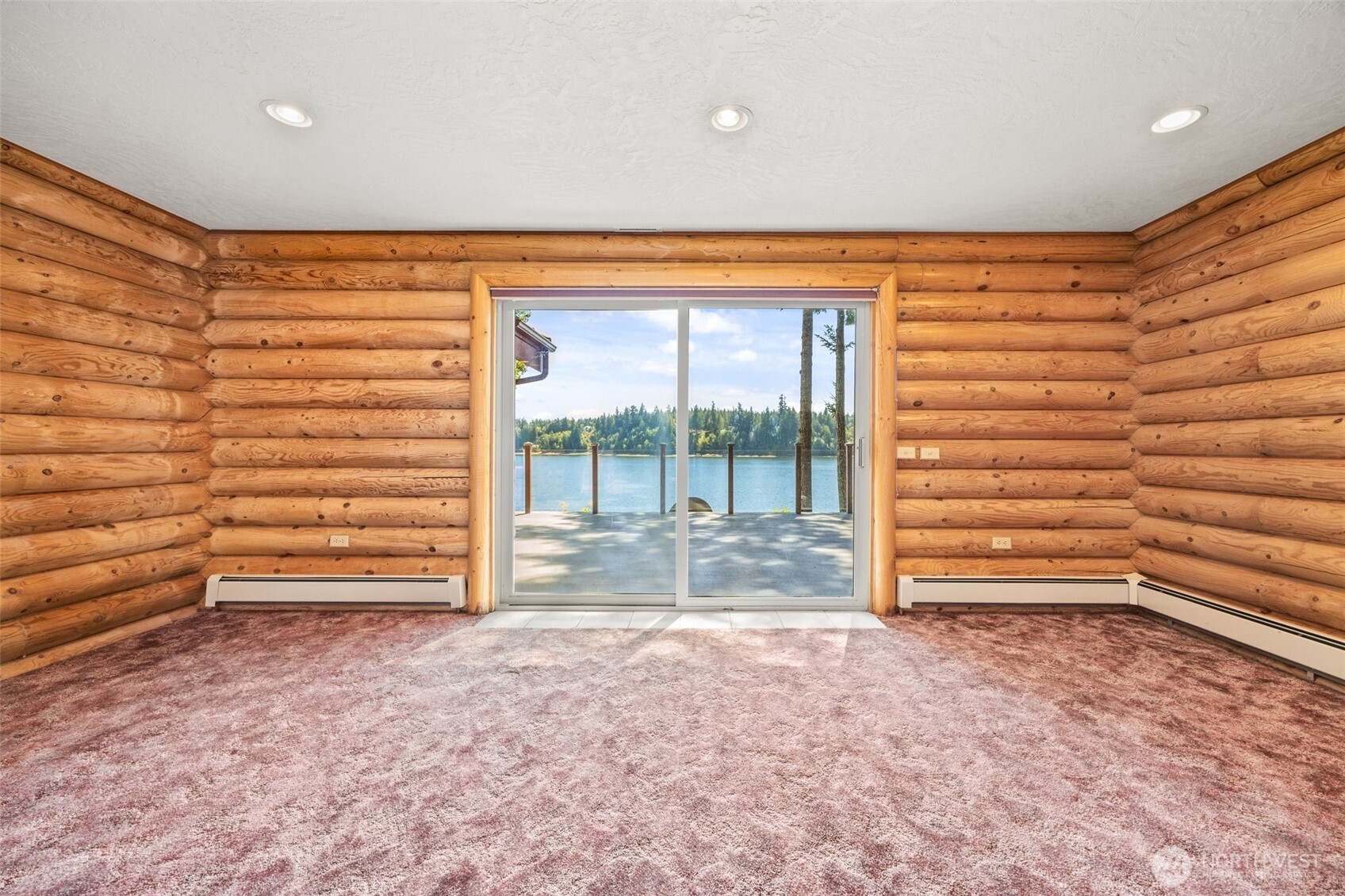 1236 East Island View Road Grapeview, WA 98546 - Photo 18 of 40 a view of room with a door and a window