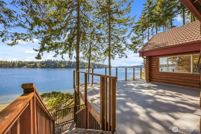 a view of a chairs and table in the balcony