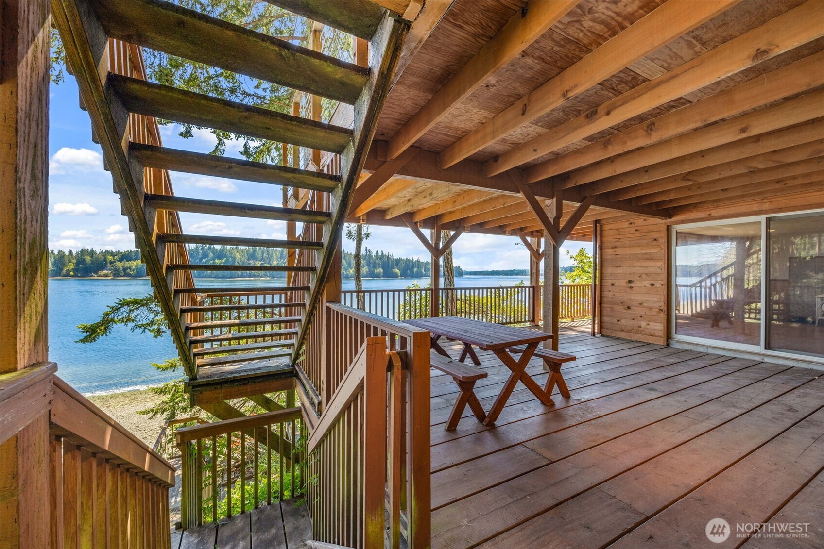1236 East Island View Road Grapeview, WA 98546 - Photo 30 of 40 a view of a chairs and table in the balcony