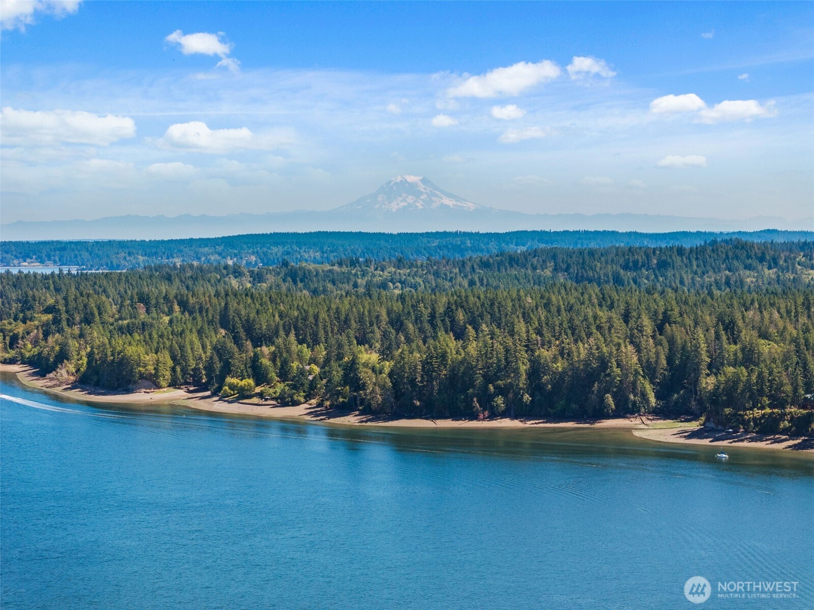 1236 East Island View Road Grapeview, WA 98546 - Photo 39 of 40 a view of a lake with houses in the back