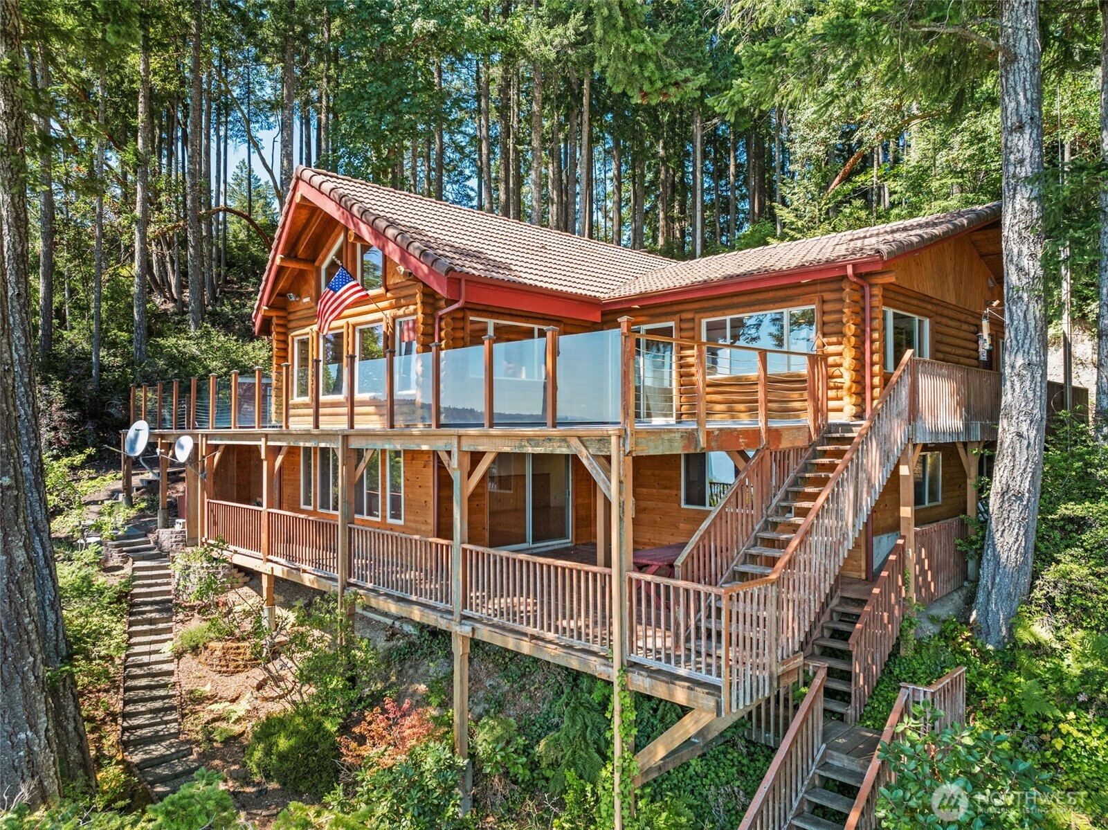 1236 East Island View Road Grapeview, WA 98546 - Photo 4 of 40 a view of a house with iron fence