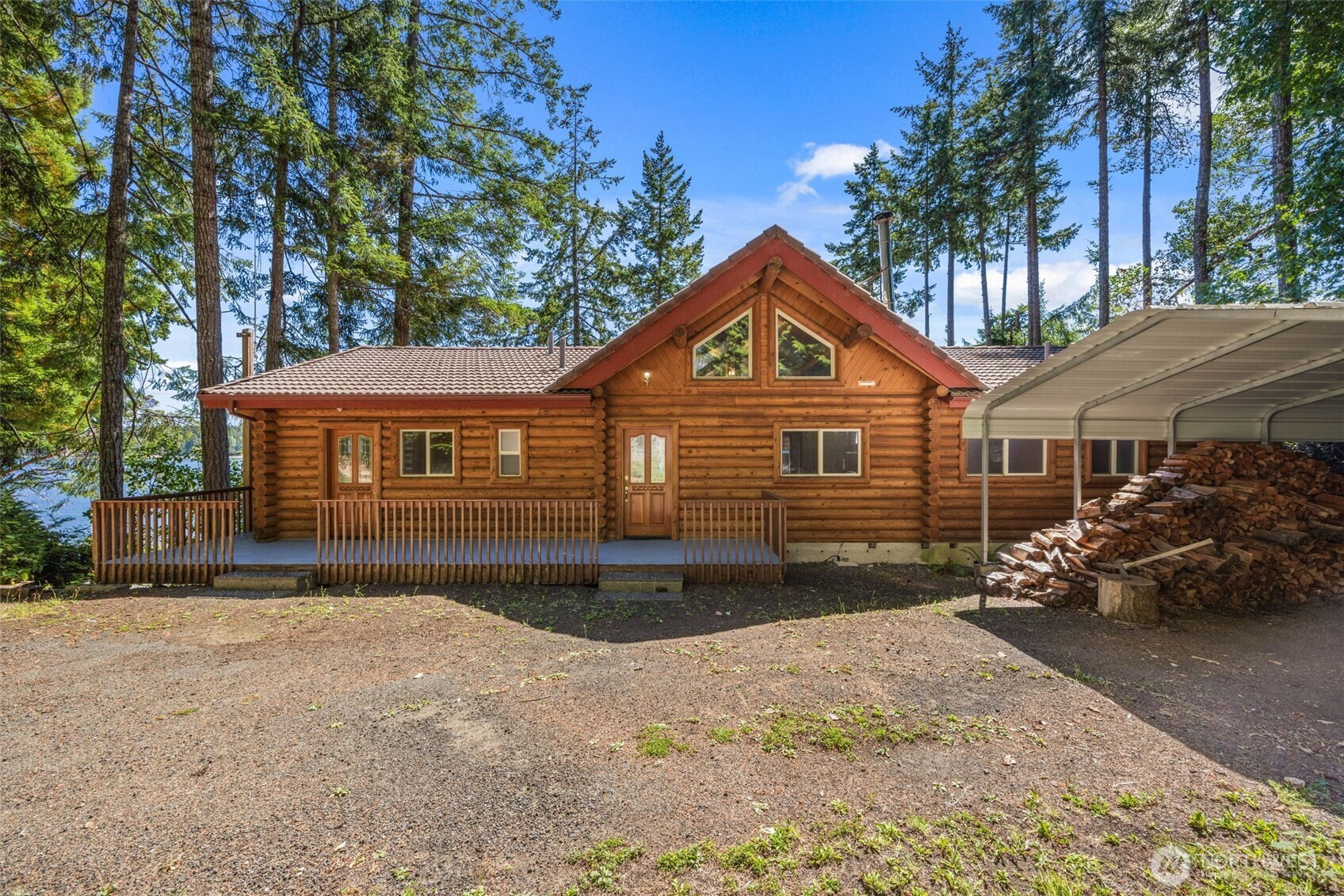 1236 East Island View Road Grapeview, WA 98546 - Photo 6 of 40 a front view of a house with a yard
