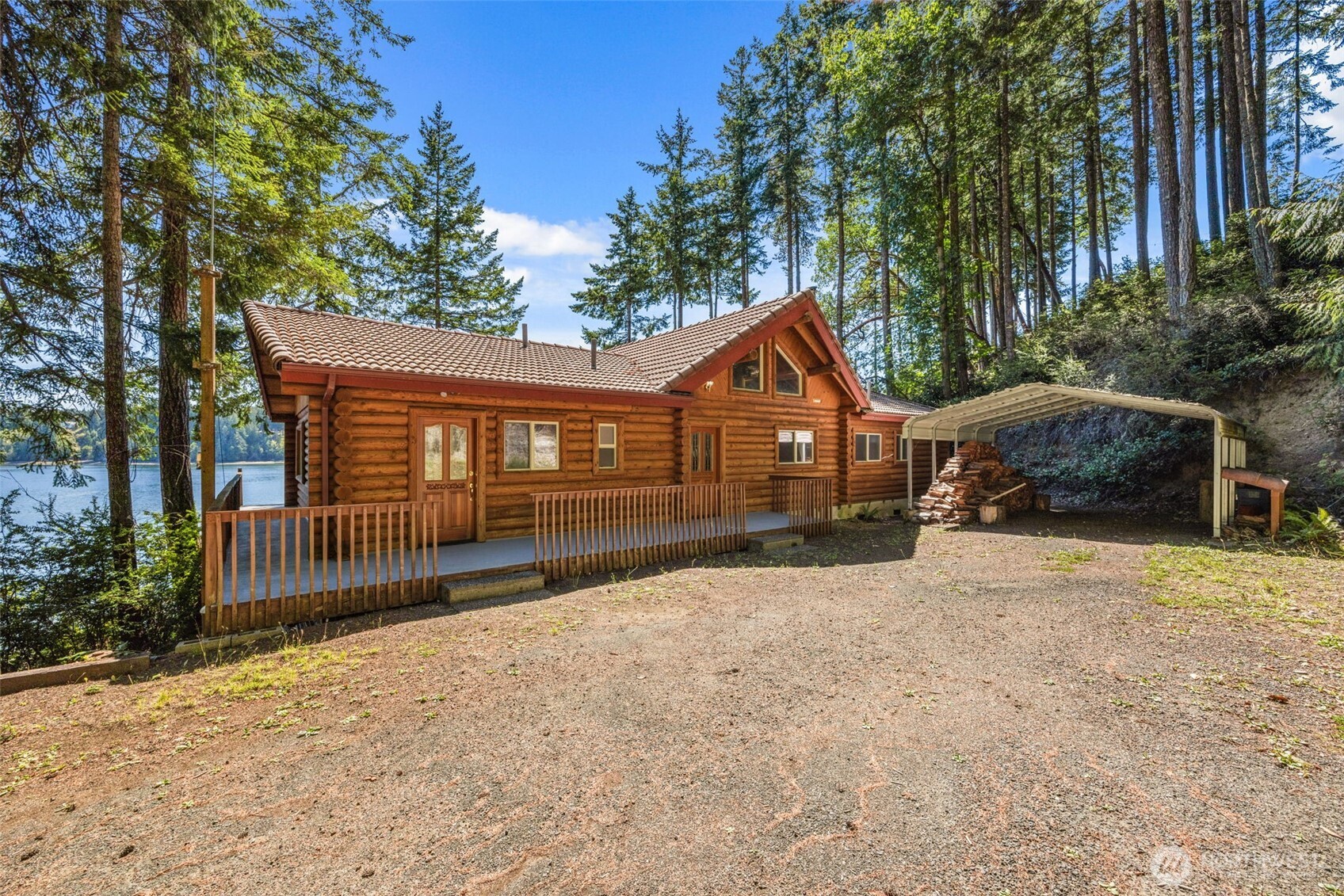 1236 East Island View Road Grapeview, WA 98546 - Photo 7 of 40 a front view of a house with a yard