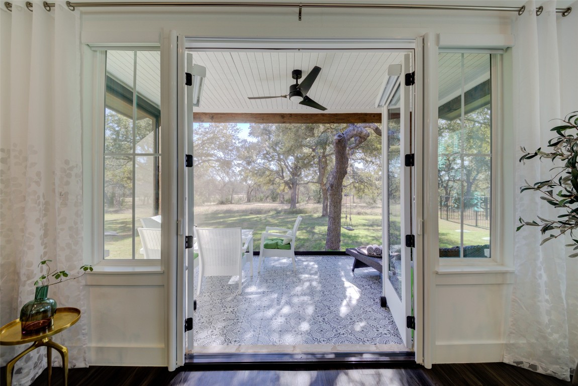 a view of room with window and wooden floor
