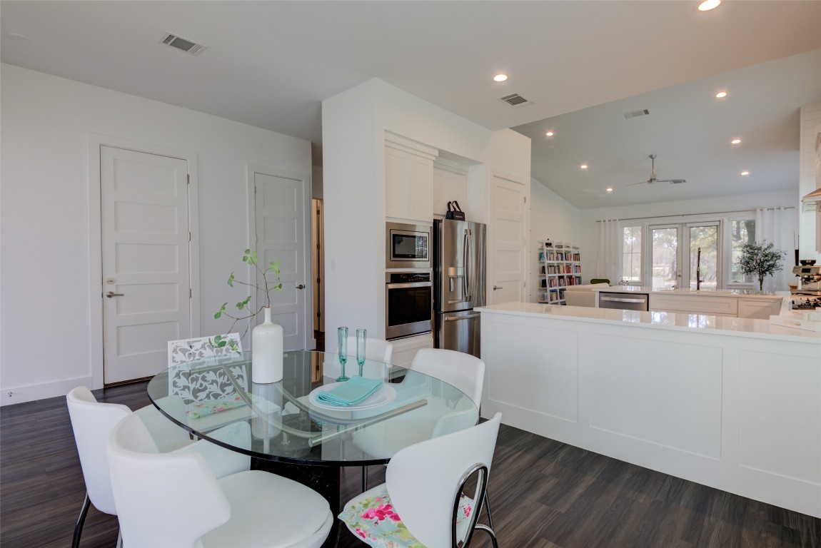 170 Bunker Rnch Boulevard, Unit 64 Dripping Springs, TX 78620 - Photo 13 of 37 a living room with furniture and a dining table