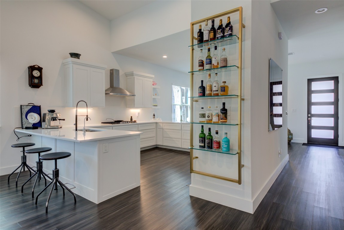 170 Bunker Rnch Boulevard, Unit 64 Dripping Springs, TX 78620 - Photo 14 of 37 a kitchen with stainless steel appliances a sink and cabinets