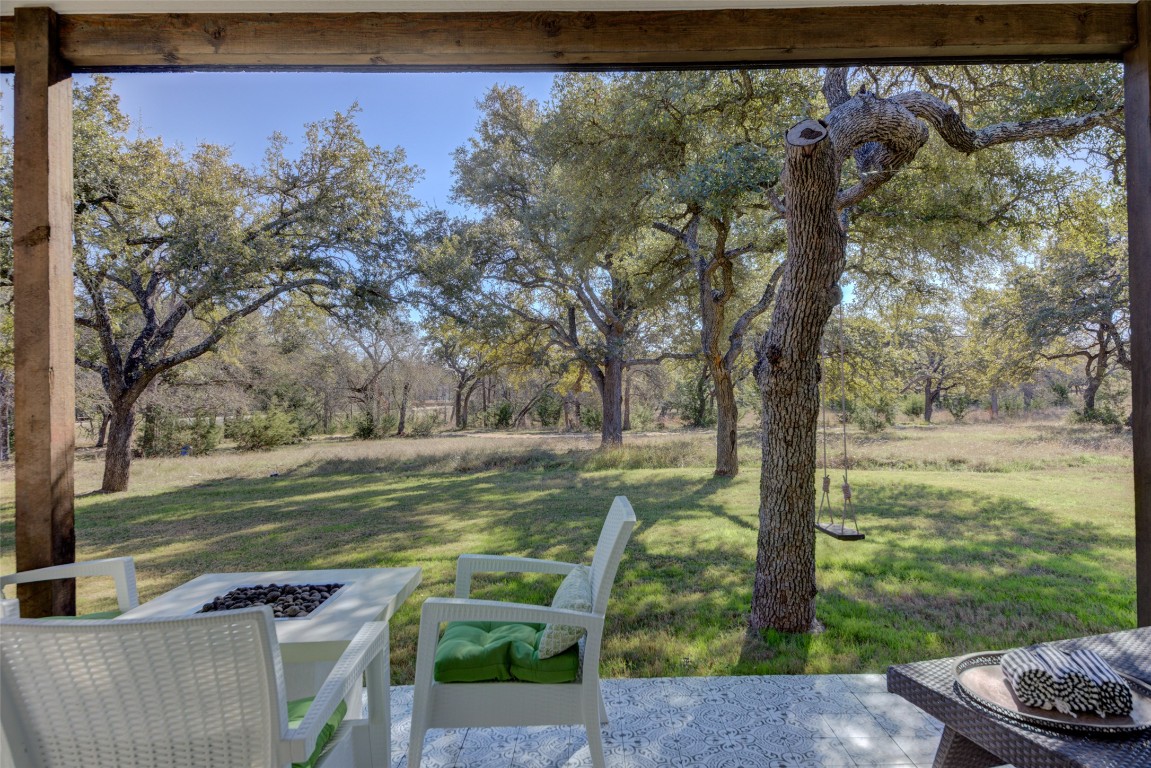 170 Bunker Rnch Boulevard, Unit 64 Dripping Springs, TX 78620 - Photo 22 of 37 a view of a yard with a tree