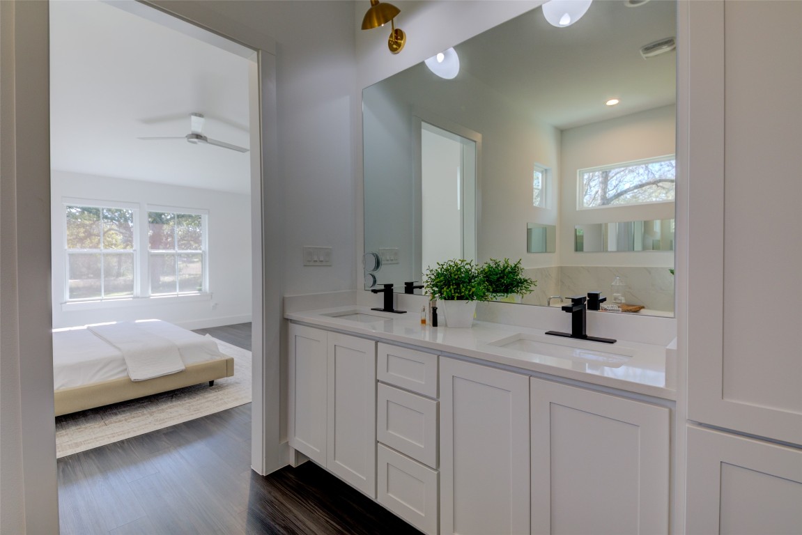 170 Bunker Rnch Boulevard, Unit 64 Dripping Springs, TX 78620 - Photo 27 of 37 a en suite bathroom with a sink and mirror