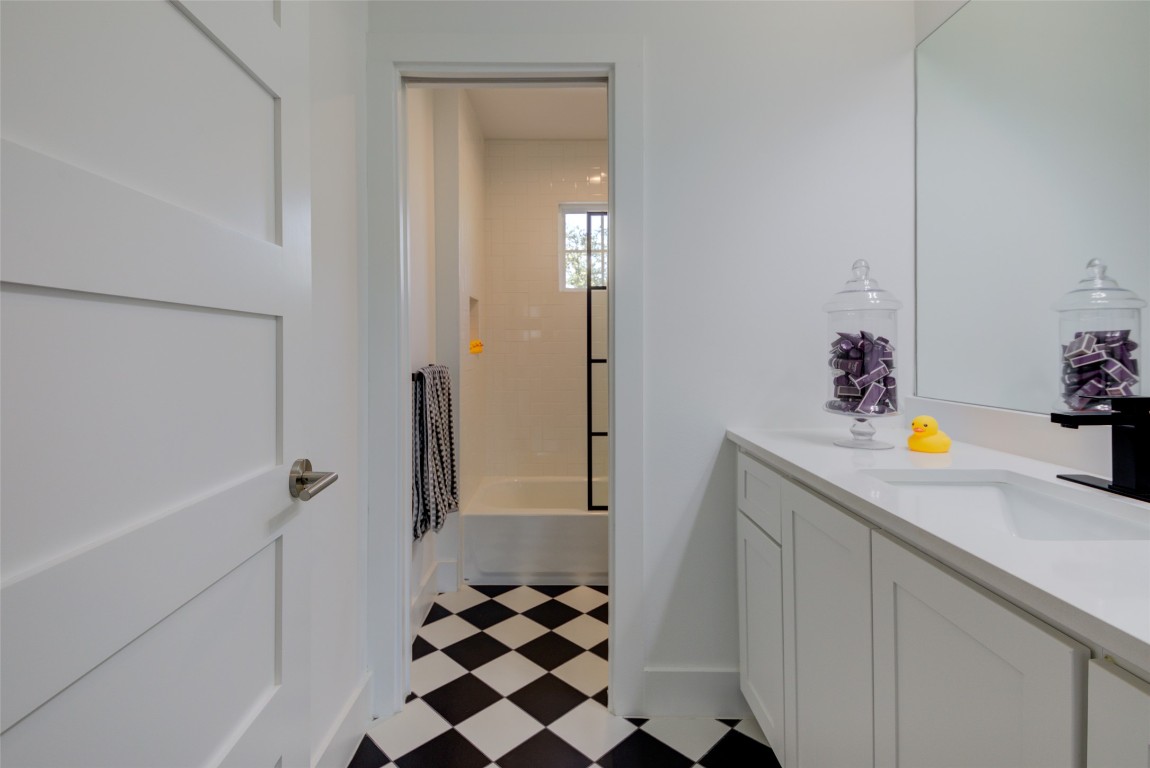 170 Bunker Rnch Boulevard, Unit 64 Dripping Springs, TX 78620 - Photo 33 of 37 a room with a refrigerator and cabinets
