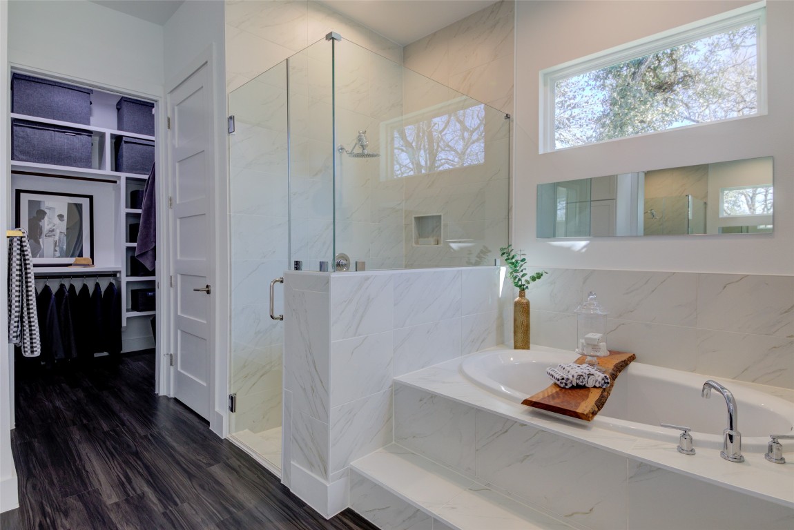 170 Bunker Rnch Boulevard, Unit 64 Dripping Springs, TX 78620 - Photo 5 of 37 a bathroom with a tub and a shower
