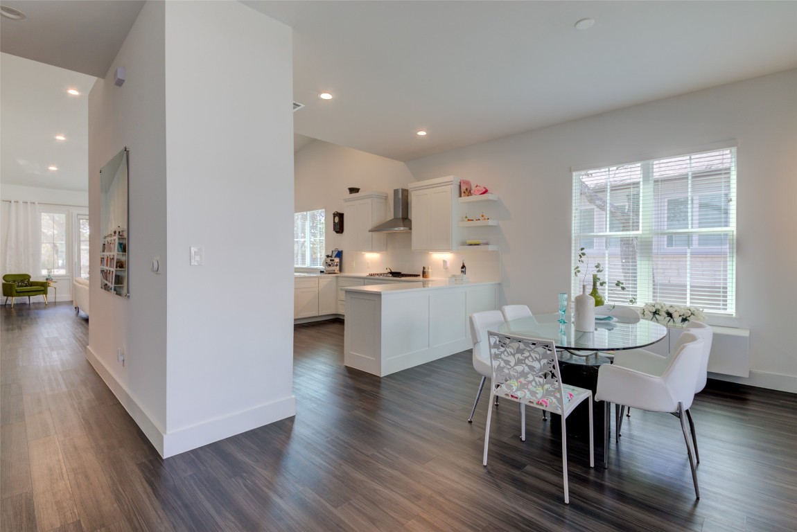170 Bunker Rnch Boulevard, Unit 64 Dripping Springs, TX 78620 - Photo 10 of 37 a view of a dining room with furniture window and wooden floor
