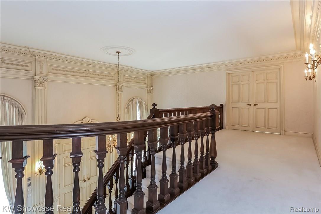 1900 East Vly Road Bloomfield Hills, MI 48304 - Photo 27 of 68 Upper Level Hallway with French Doorway into Master Bedroom and Two Master Baths. Showcasing fine crafted crown dentil molding.
