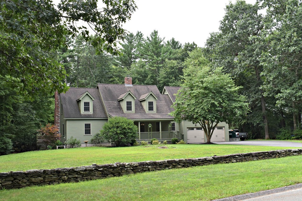 37 Throne Hill Road Groton, MA 01450 - Photo 1 of 30 a front view of a house with a garden