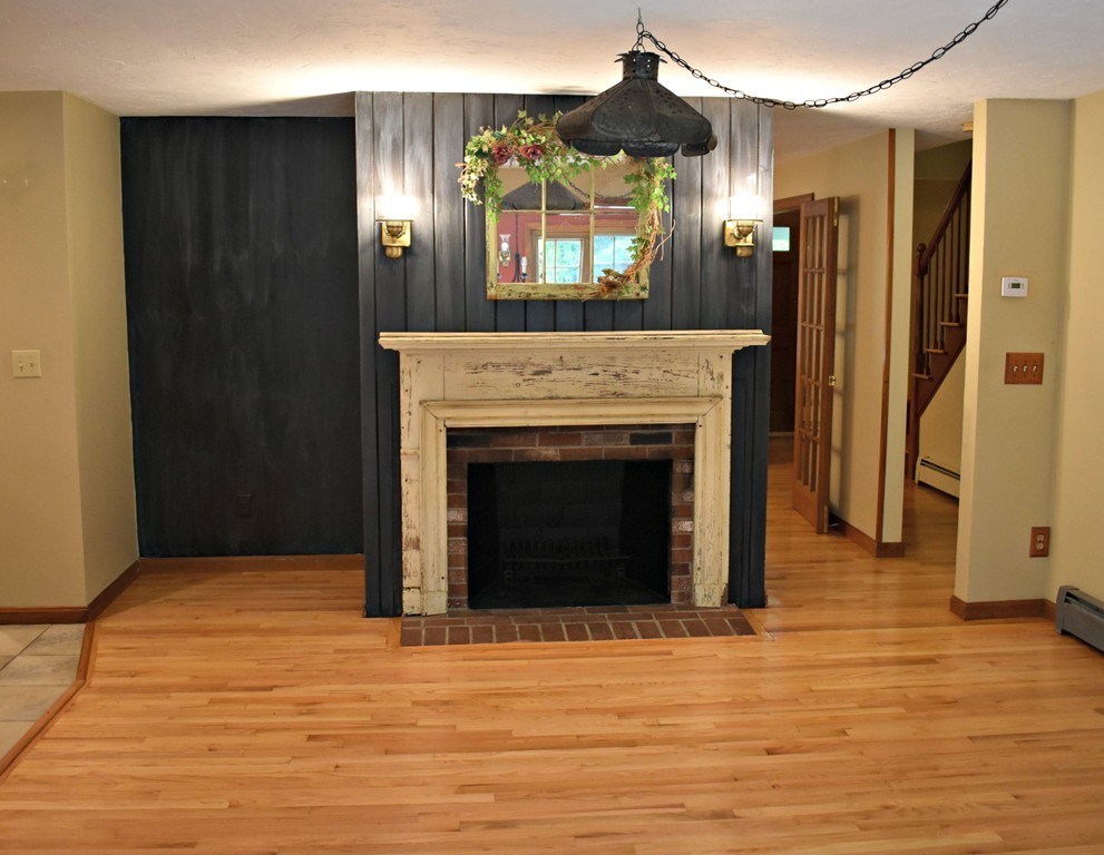 37 Throne Hill Road Groton, MA 01450 - Photo 14 of 30 a view of a livingroom with a fireplace and window