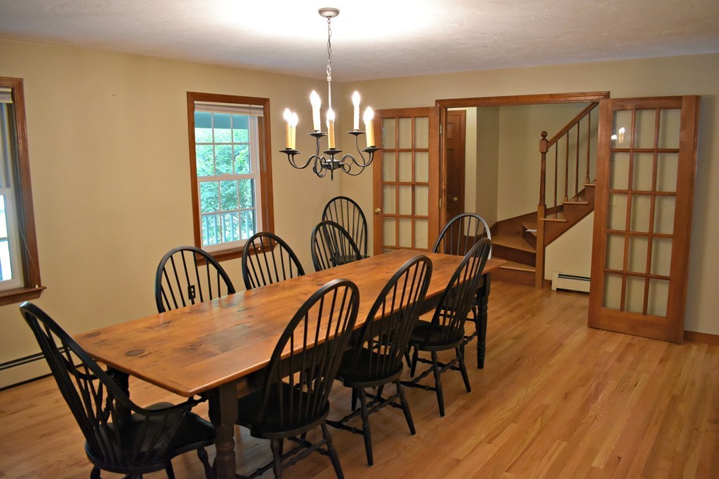37 Throne Hill Road Groton, MA 01450 - Photo 16 of 30 a view of a a dining room with furniture window and wooden floor