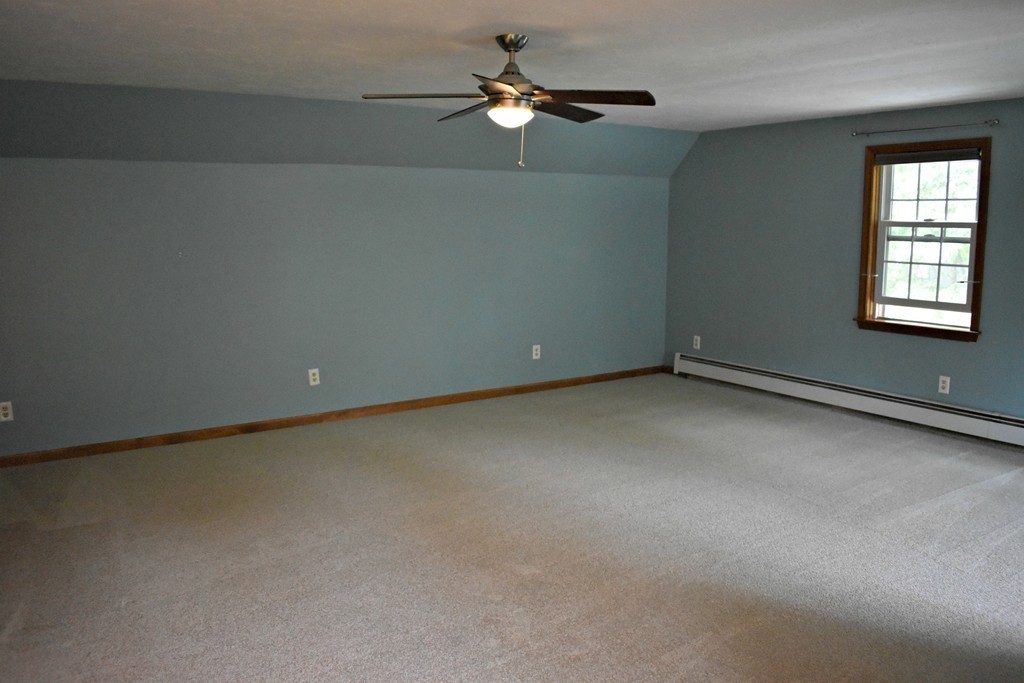 37 Throne Hill Road Groton, MA 01450 - Photo 27 of 30 an empty room with a window and a ceiling fan