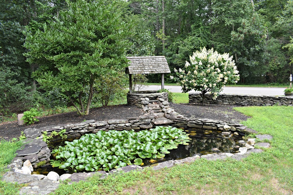 37 Throne Hill Road Groton, MA 01450 - Photo 4 of 30 a view of a garden with a pathway