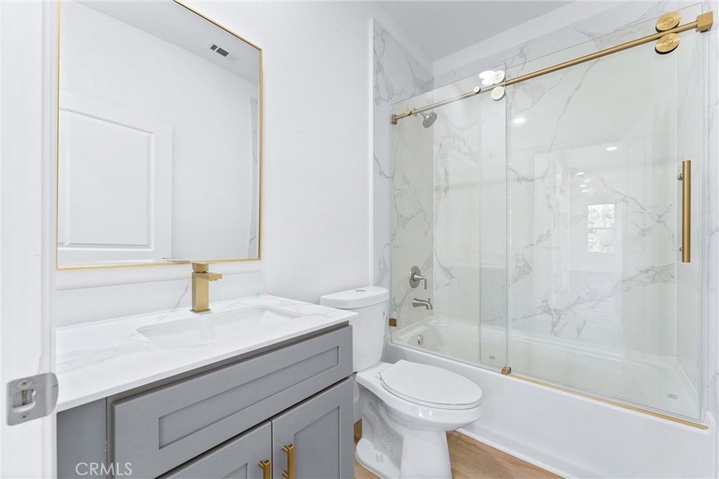 1981 Lyon Avenue Riverside, CA 92503 - Photo 17 of 58 a bathroom with a sink a toilet and shower