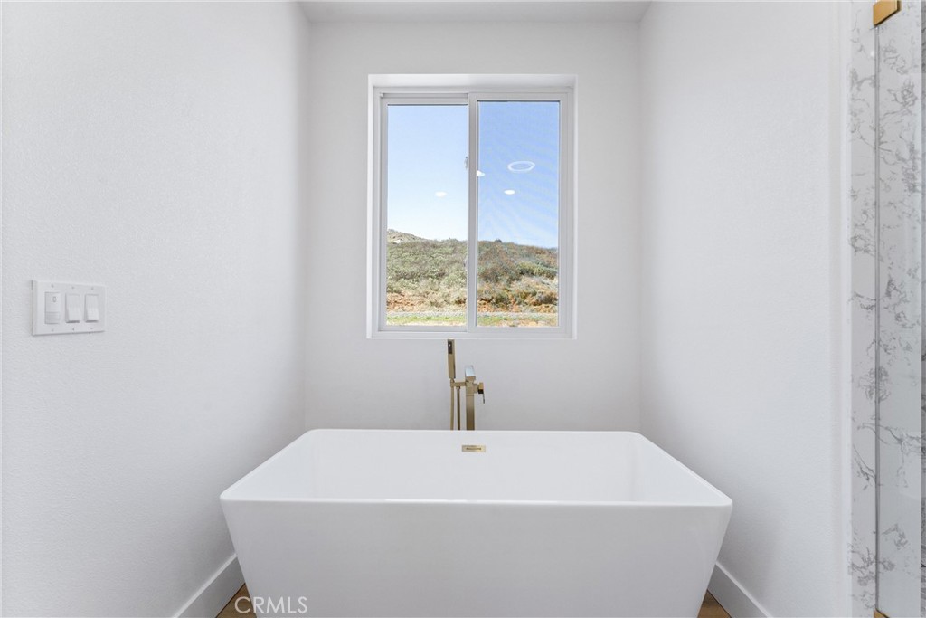 1981 Lyon Avenue Riverside, CA 92503 - Photo 22 of 58 a white bath tub sitting in a bathroom