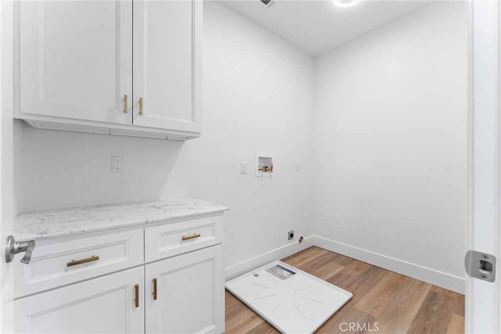 1981 Lyon Avenue Riverside, CA 92503 - Photo 27 of 58 a view of storage area and utility room with wooden floor