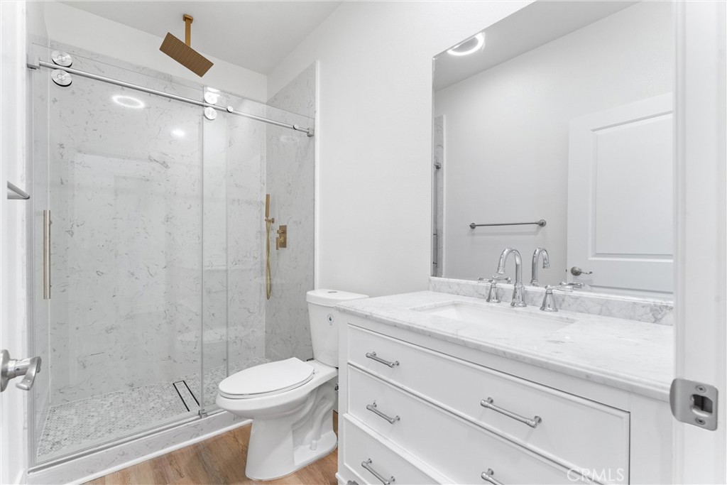 1981 Lyon Avenue Riverside, CA 92503 - Photo 30 of 58 a bathroom with a sink a toilet and shower