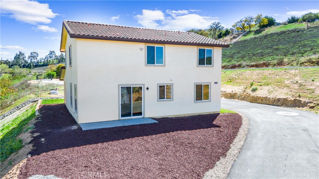 1981 Lyon Avenue Riverside, CA 92503 - Photo 3 of 58 a front view of a house with a yard