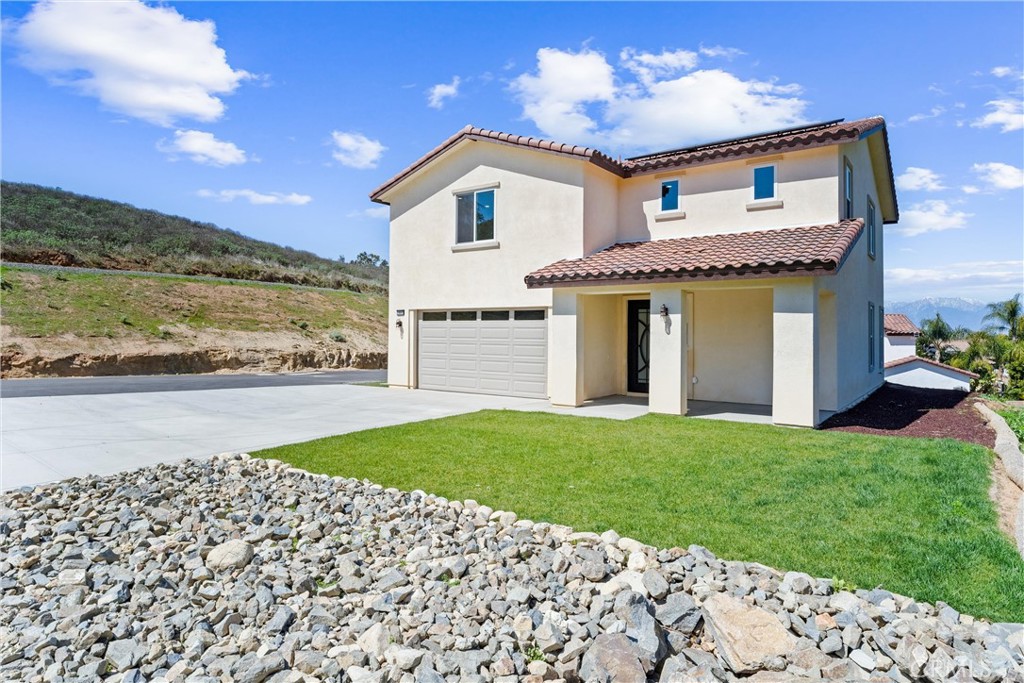 1981 Lyon Avenue Riverside, CA 92503 - Photo 41 of 58 a front view of a house with a yard
