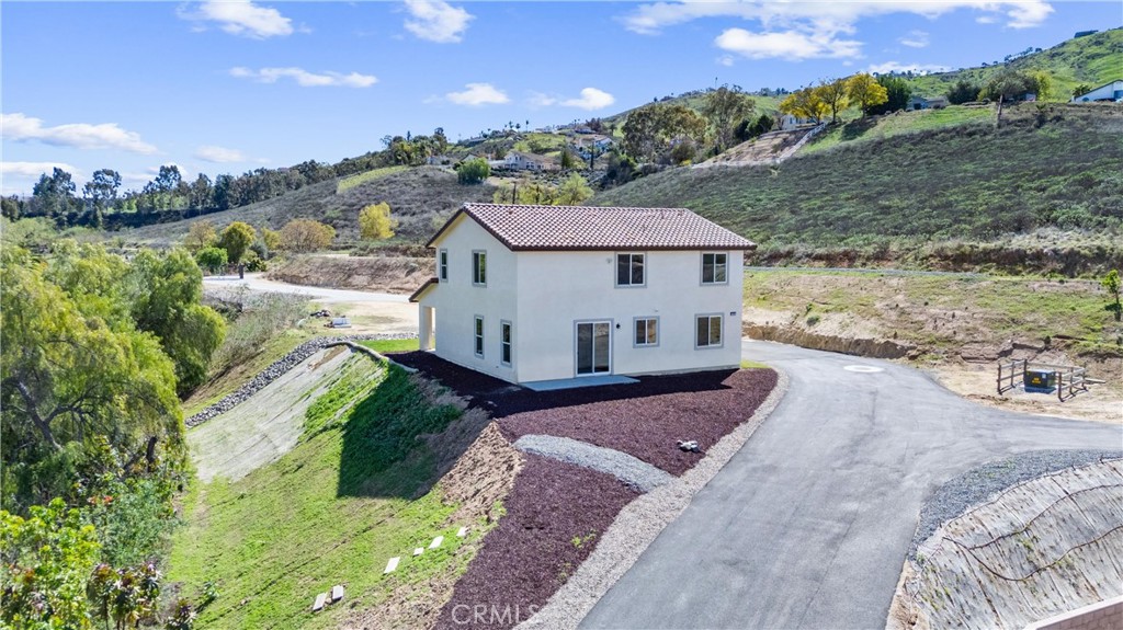 1981 Lyon Avenue Riverside, CA 92503 - Photo 49 of 58 a view of a house with a yard