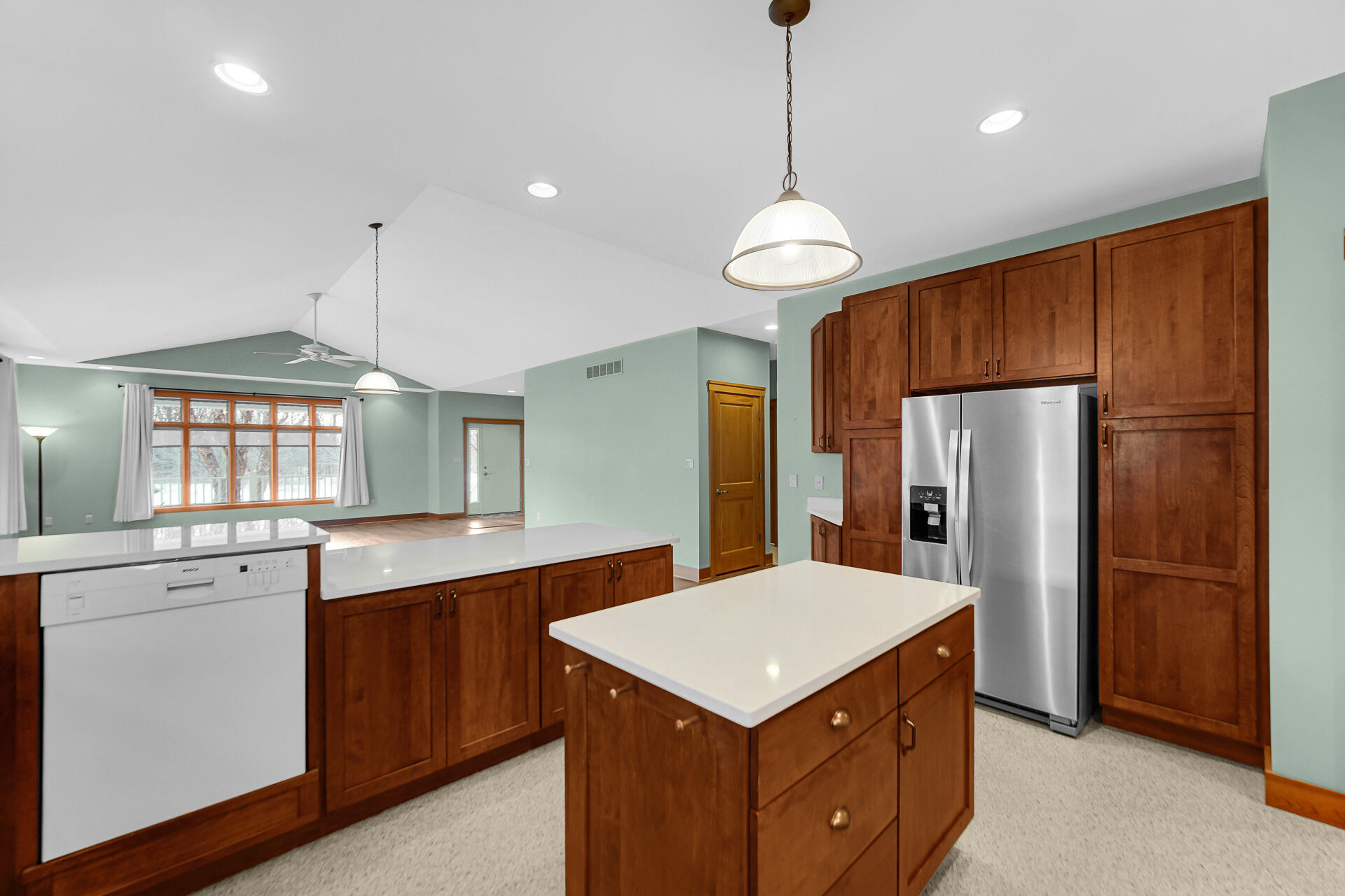 2425 Dickinson Road Chesterton, IN 46304 - Photo 14 of 41 a kitchen with a center island and wooden cabinets