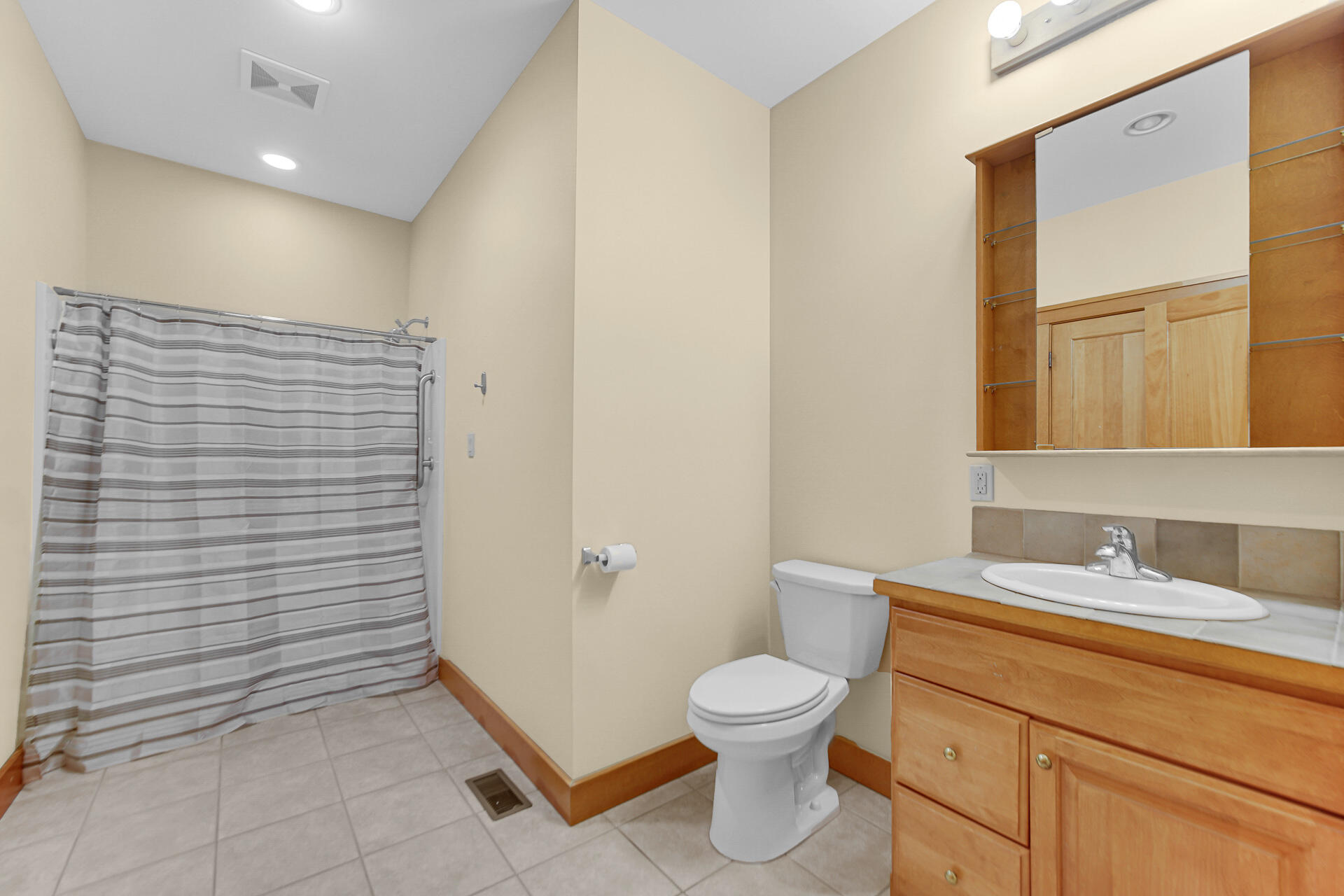 2425 Dickinson Road Chesterton, IN 46304 - Photo 26 of 41 a bathroom with a toilet sink and shower