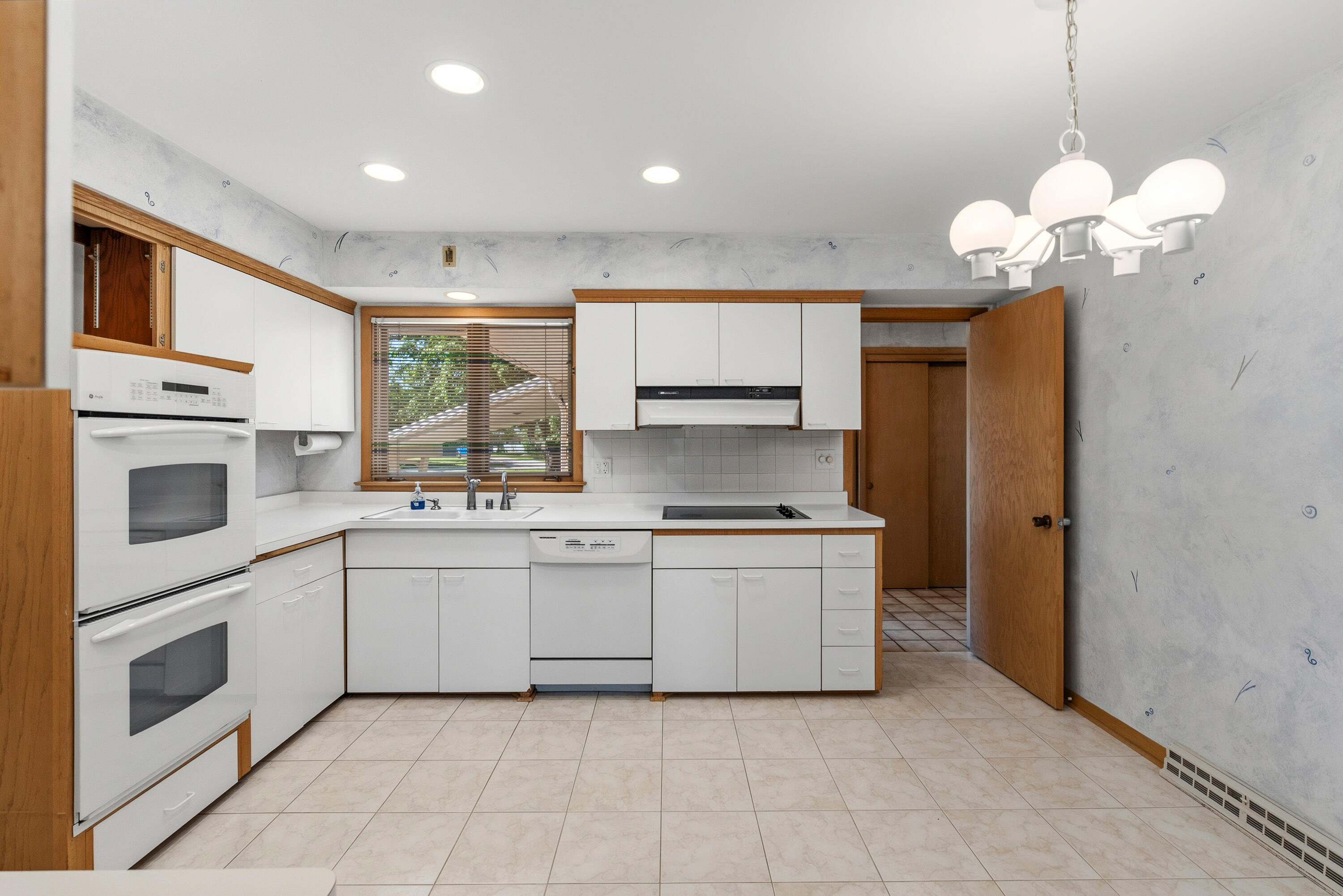 8909 North Maitland Road Bayside, WI 53217 - Photo 11 of 40 double oven, cooktop, dishwasher, refrigerator.