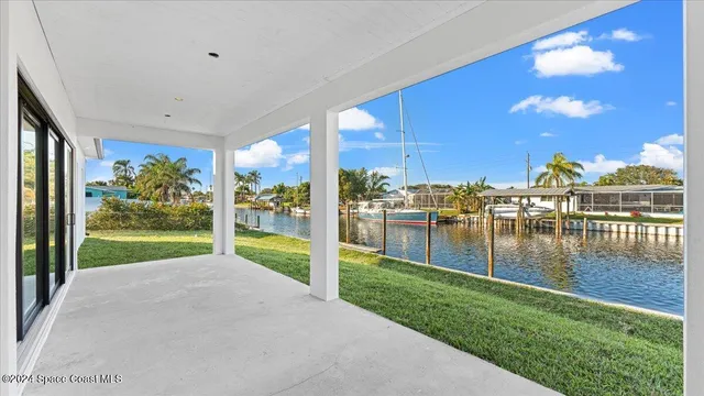 a view of a living room and chandelier