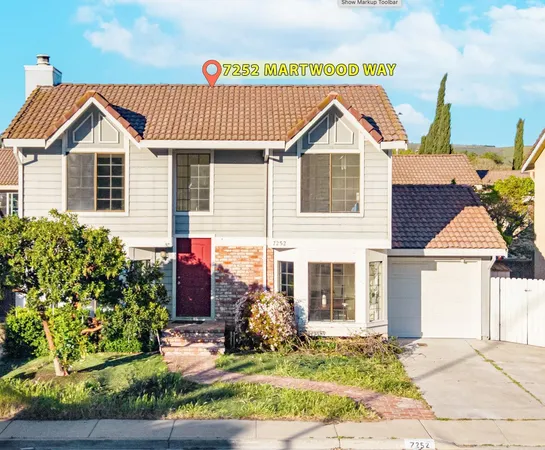 a view of front of house with a yard