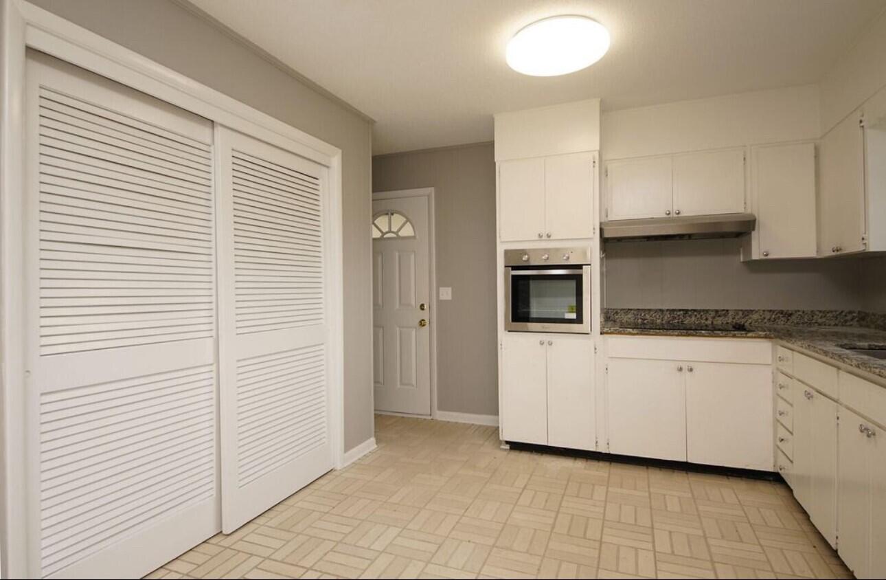 315 Sudduth Circle Northeast Fort Walton Beach, FL 32548 - Photo 12 of 30 a kitchen with a cabinets and white appliances