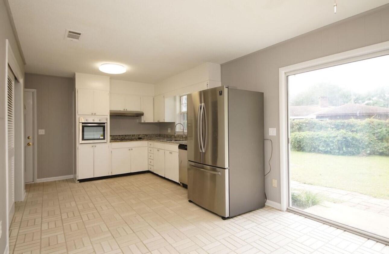 315 Sudduth Circle Northeast Fort Walton Beach, FL 32548 - Photo 14 of 30 a kitchen with stainless steel appliances a refrigerator and a sink
