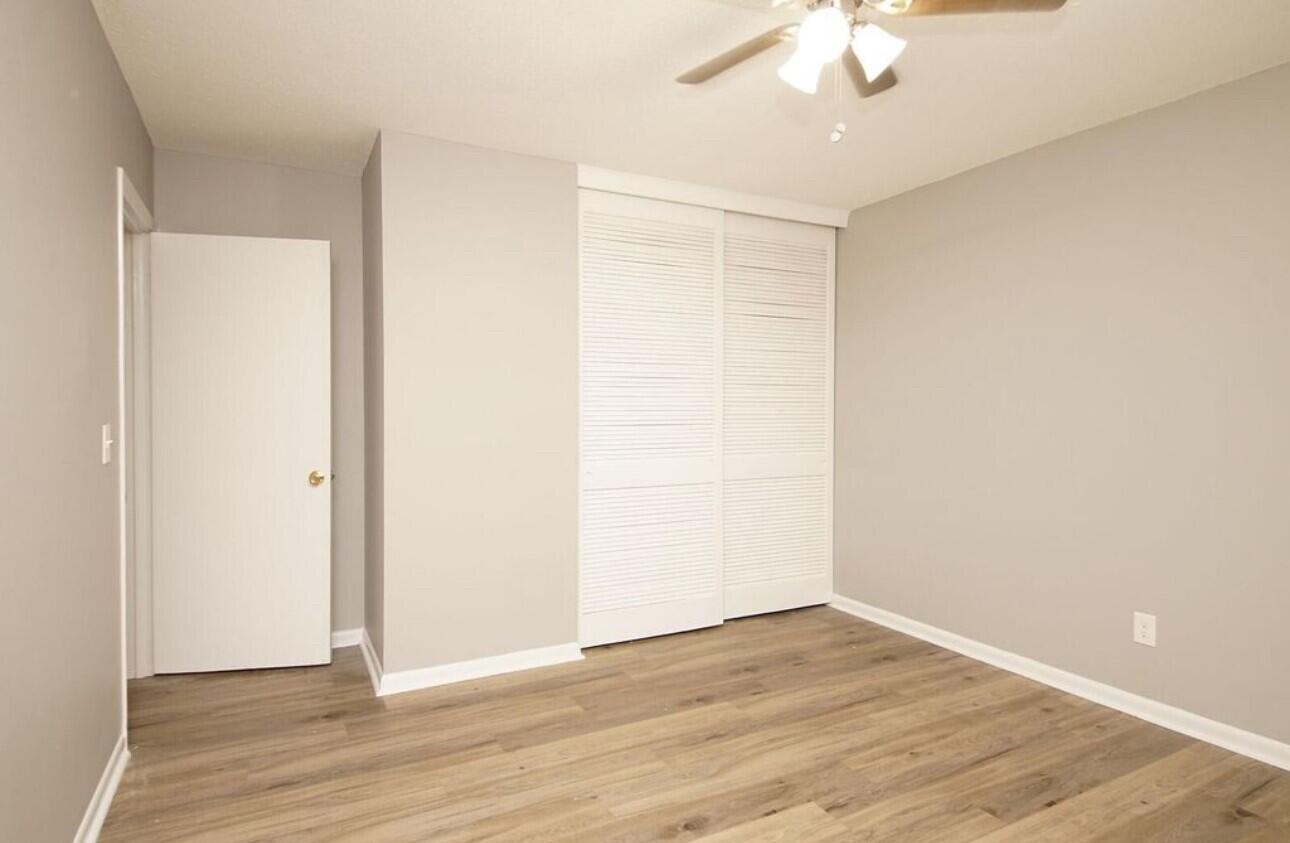 315 Sudduth Circle Northeast Fort Walton Beach, FL 32548 - Photo 17 of 30 an empty room with wooden floor and fan