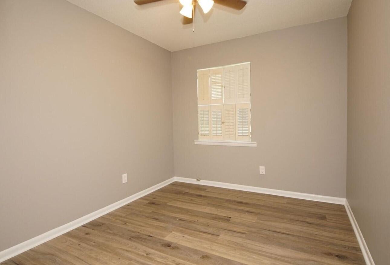 315 Sudduth Circle Northeast Fort Walton Beach, FL 32548 - Photo 20 of 30 wooden floor in an empty room with a window