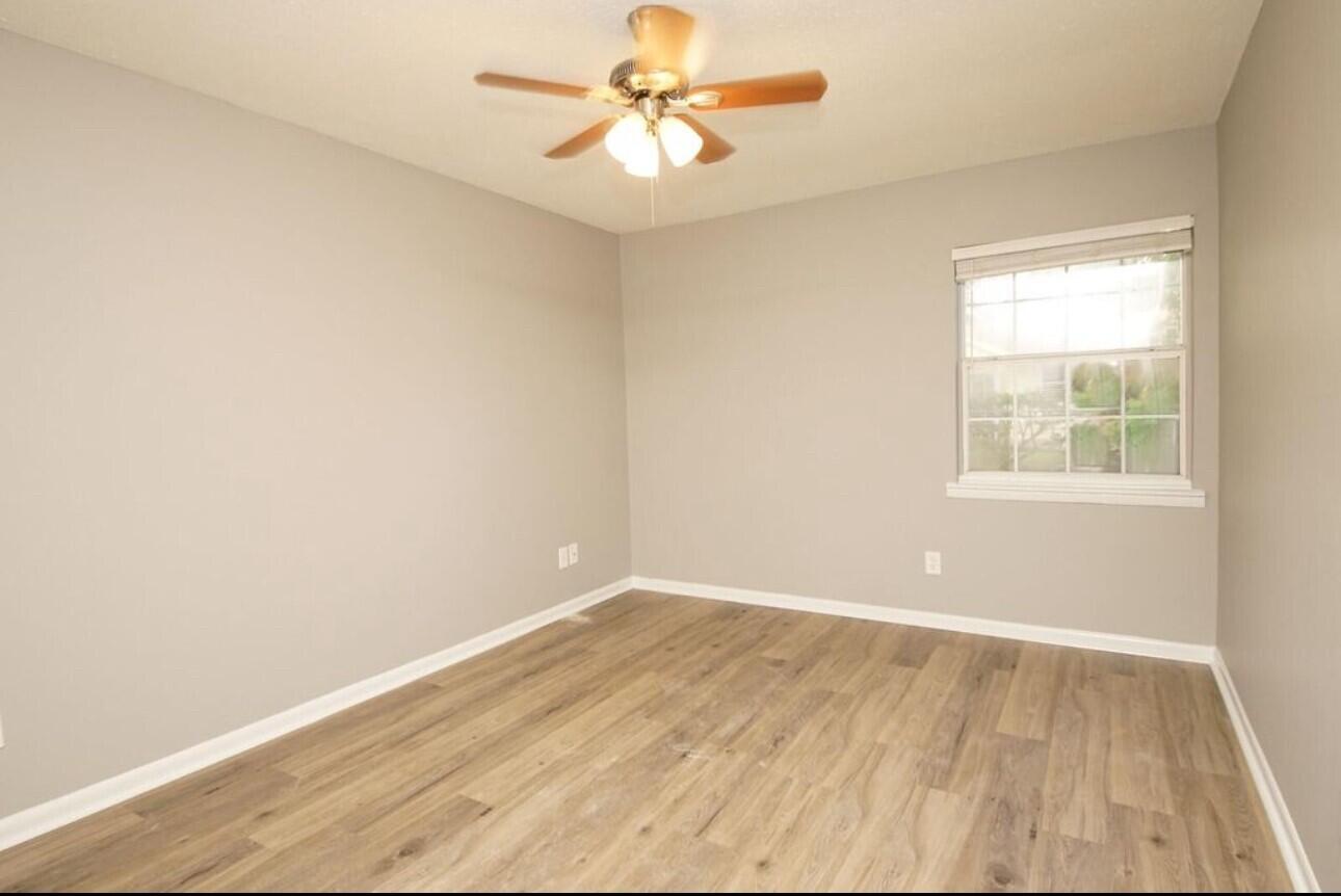 315 Sudduth Circle Northeast Fort Walton Beach, FL 32548 - Photo 8 of 30 an empty room with a window and a fan