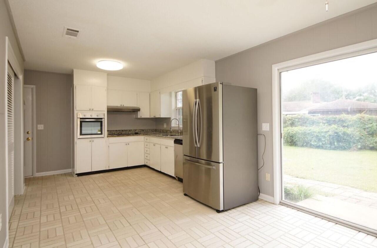 315 Sudduth Circle Northeast Fort Walton Beach, FL 32548 - Photo 10 of 30 a kitchen with stainless steel appliances a refrigerator and a sink