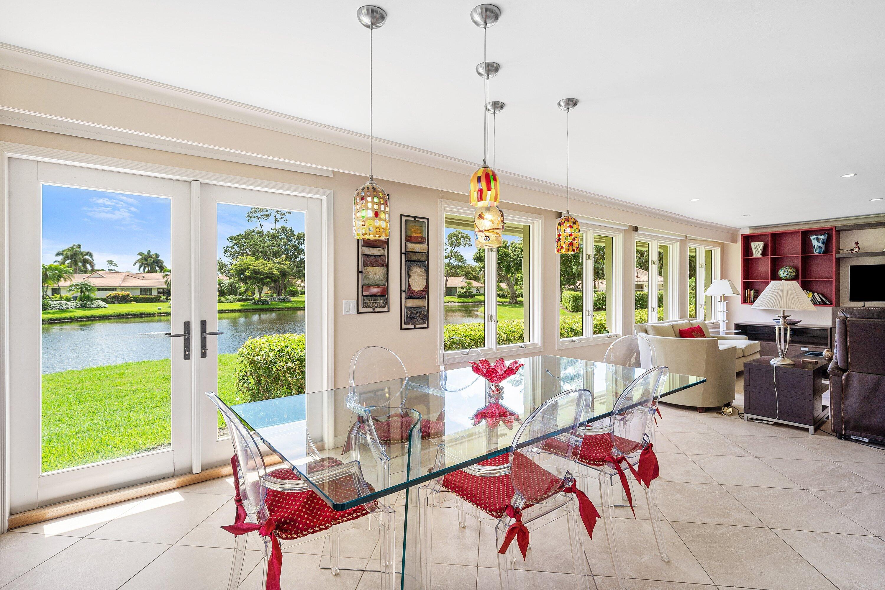 4365 Shell Drake Lane Boynton Beach, FL 33436 - Photo 13 of 56 a living room with furniture and a floor to ceiling window