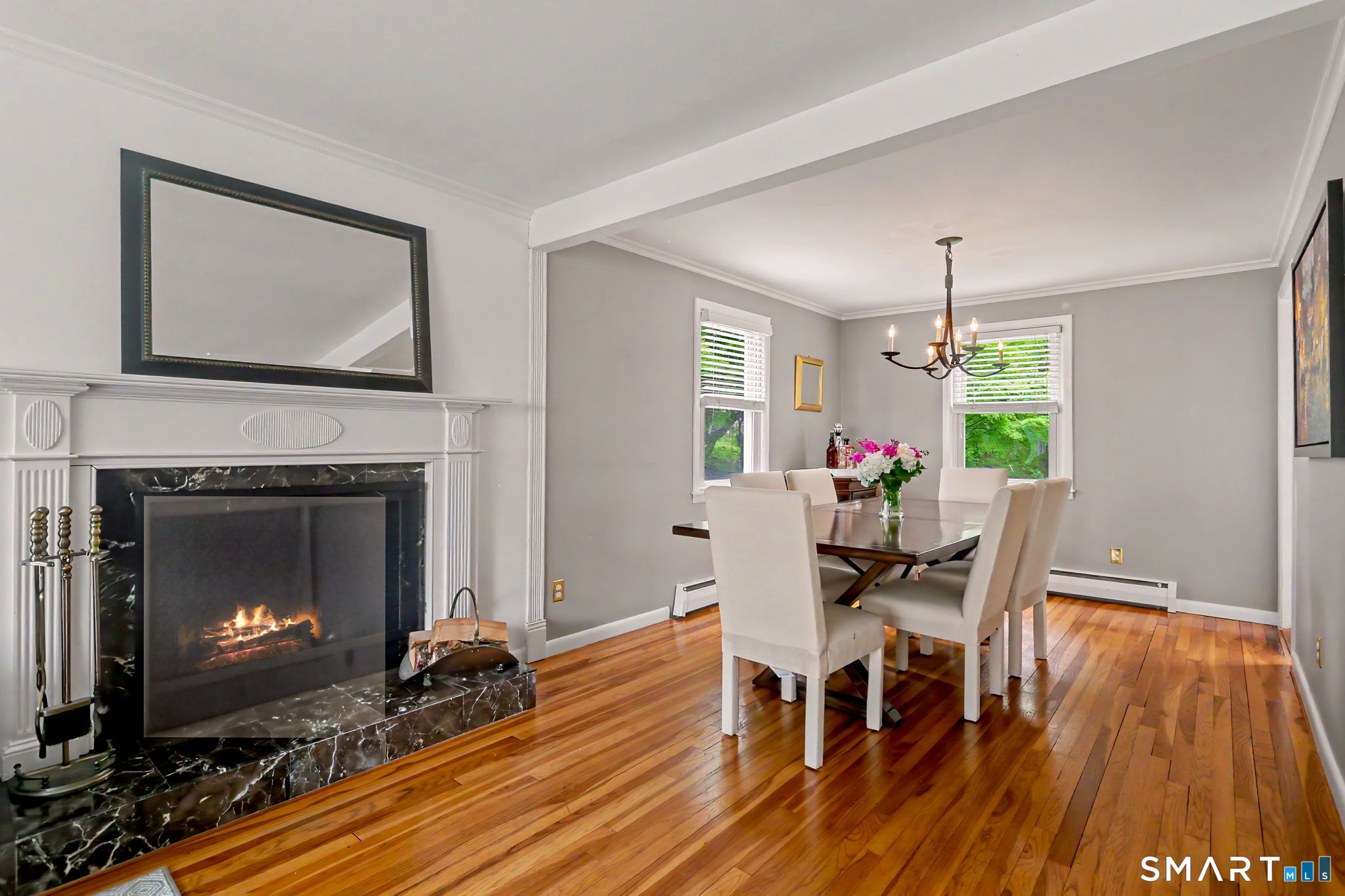 73 Oxbow Road Fairfield, CT 06824 - Photo 35 of 35 Open floor plan with wood burning fireplace between living room and dining room