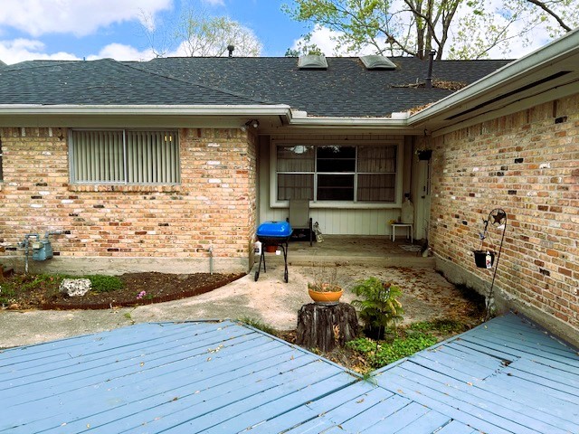 8639 Cedarbrake Drive Spring Valley Village, TX 77055 - Photo 23 of 26 Discover the charm of this inviting back patio, perfect for relaxation and outdoor gatherings, nestled within a cozy brick exterior.
